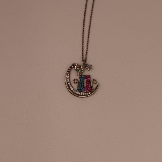 Necklace with a colorful pendant on a beige background